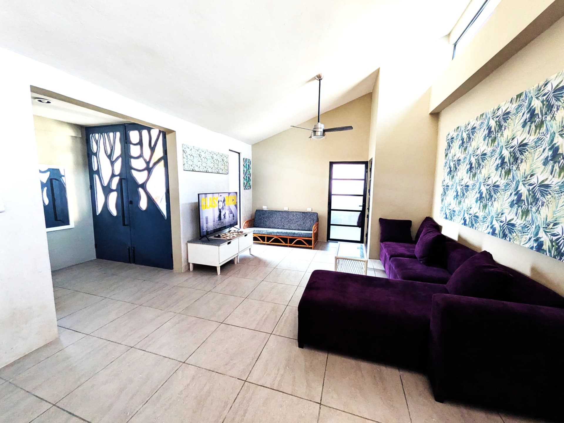 Casa Aak living area with sofas and television